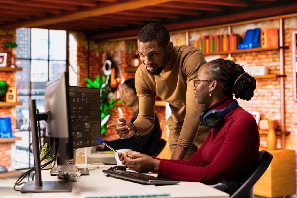 Terllio creatives collaborating at their desks